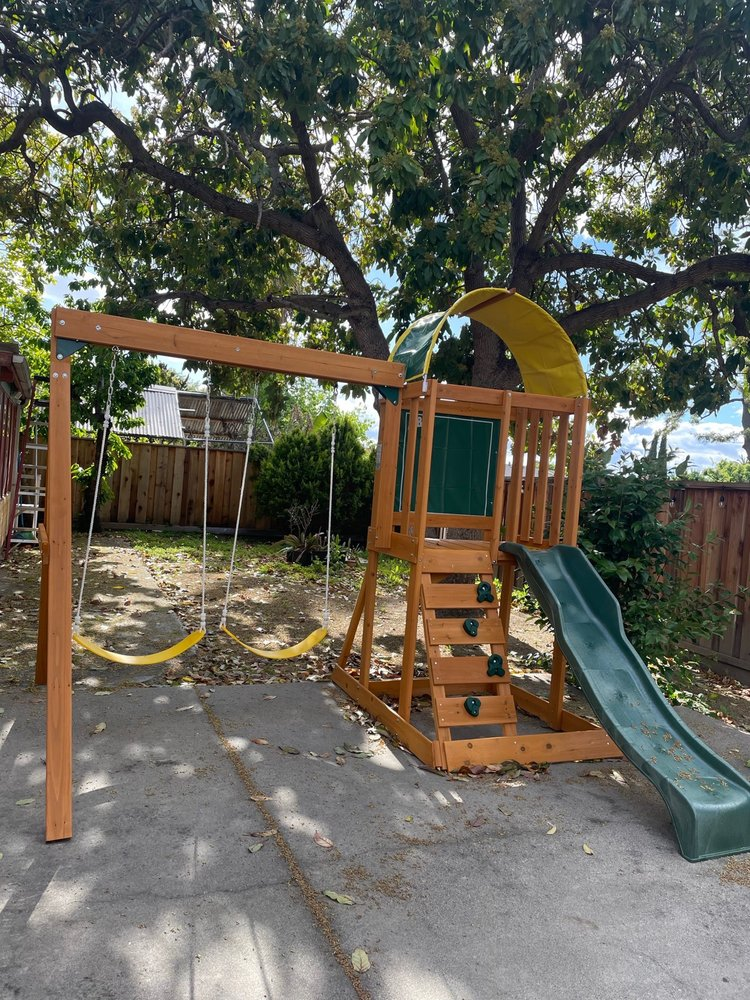 Outdoor playground with swings and slide